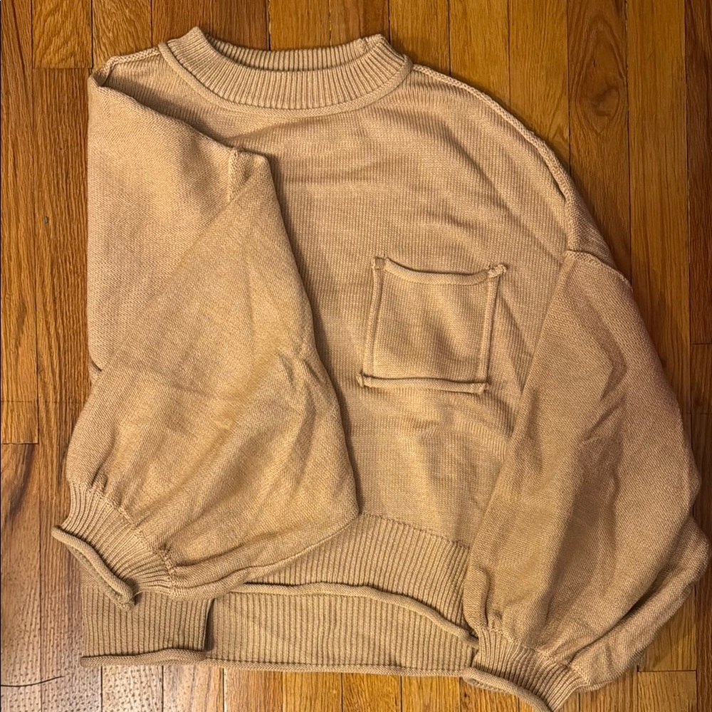 Slouchy POL sweater with bubble sleeves at the bottom and “inside out” seams